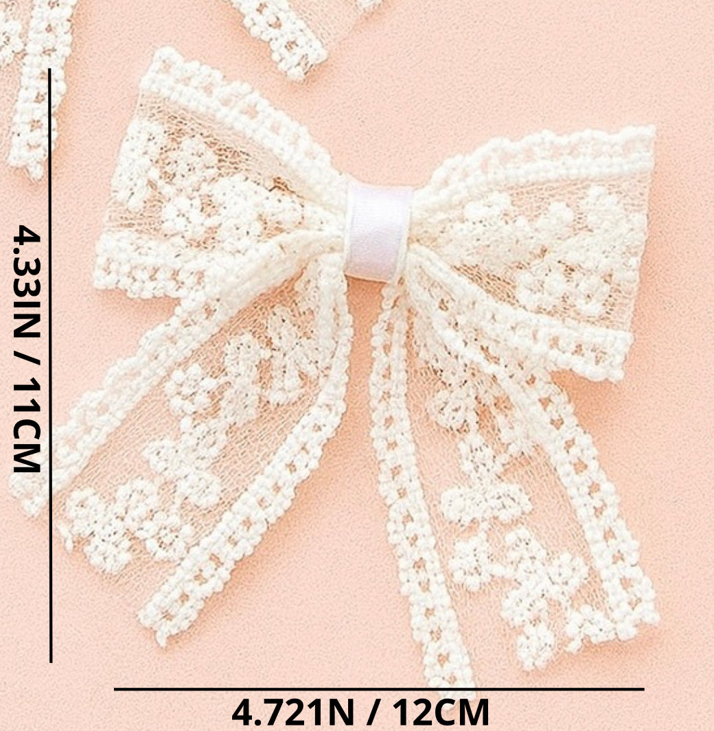 White lace bow with measurements on a pink background
