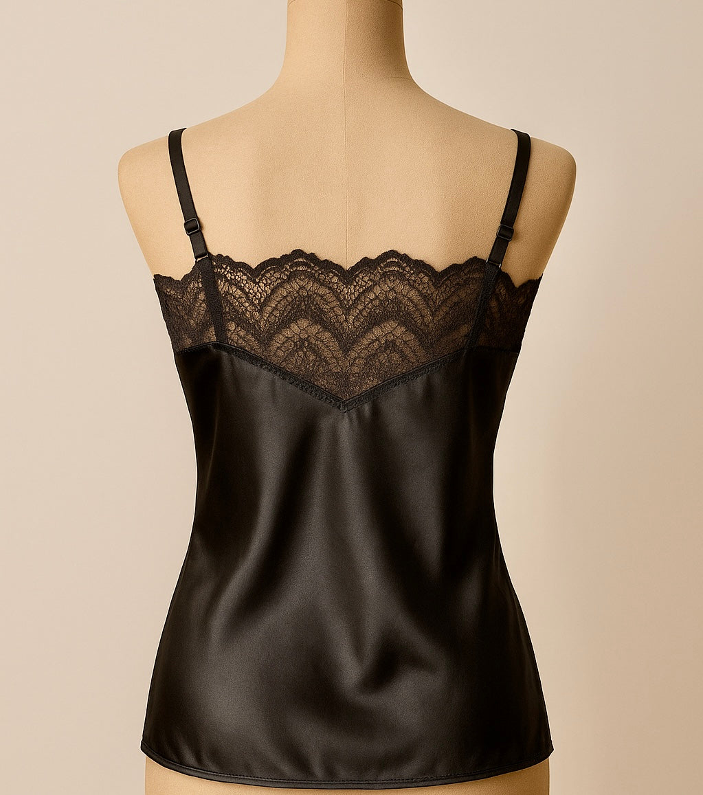 Black satin camisole with lace detailing on a beige background back 