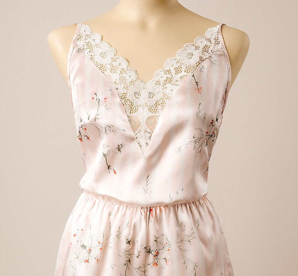 Floral set with lace details on a mannequin against a plain background