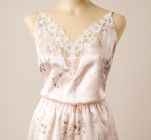 Floral set with lace details on a mannequin against a plain background