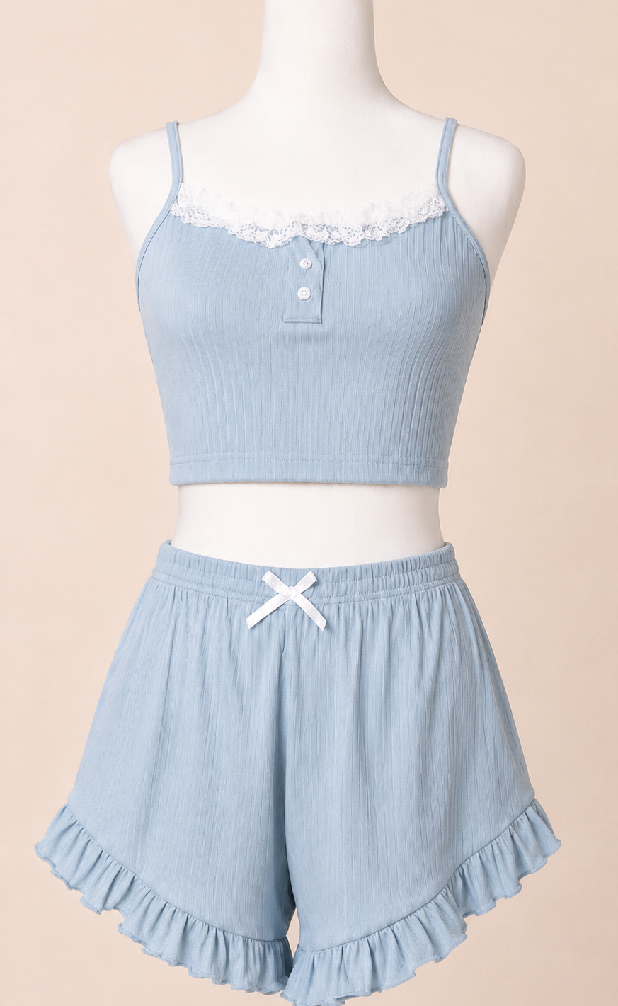 Light blue pajama set on a mannequin against a beige background