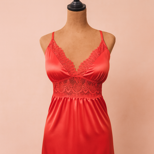 Red lace nightgown on a mannequin against a beige background