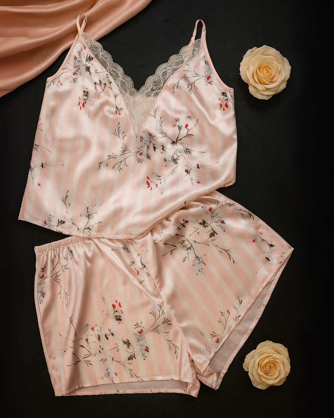 dainty lace Floral satin pajama set on a dark surface with roses.